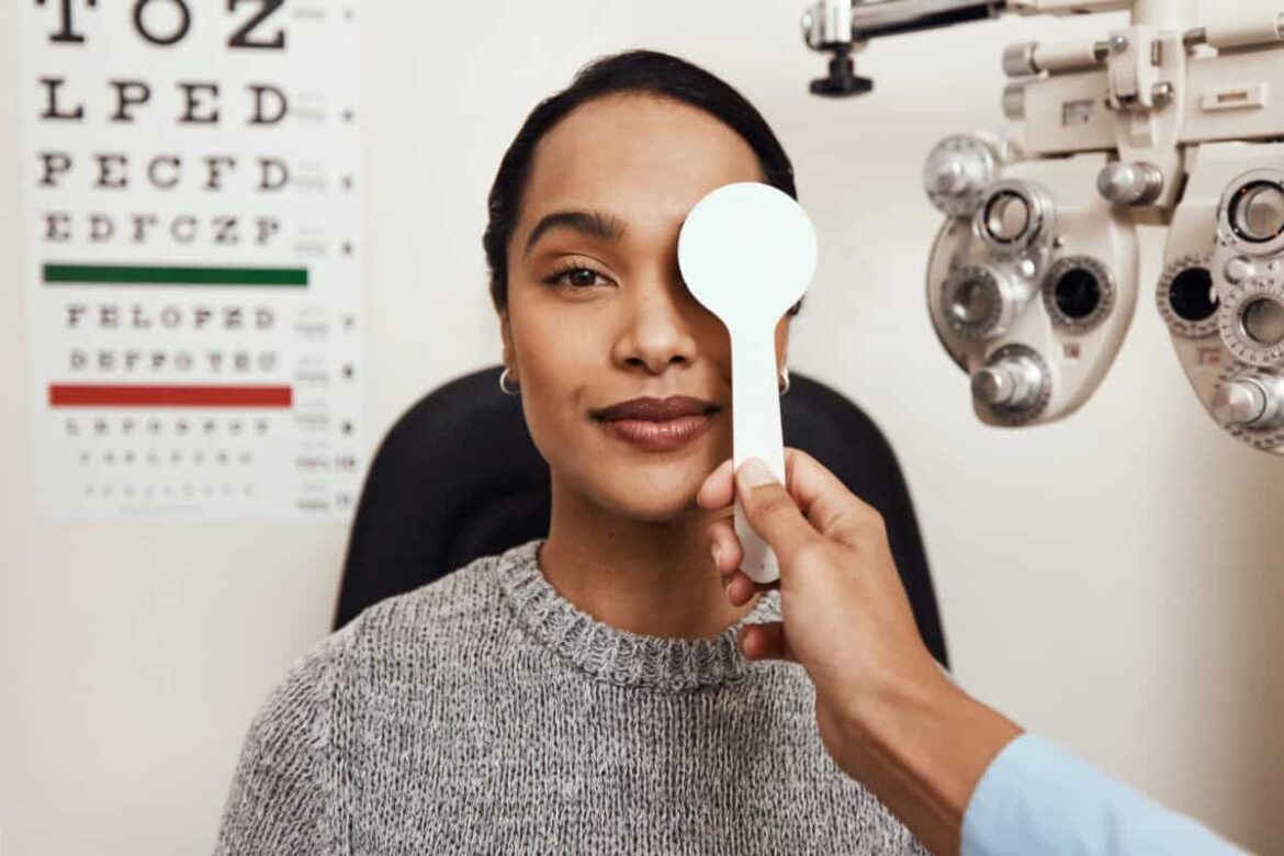 patient tests her eyes with a vision test at a doctor
